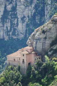 Buildings against mountains