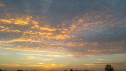 Low angle view of dramatic sky during sunset