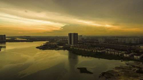 Scenic view of cityscape against sky during sunset