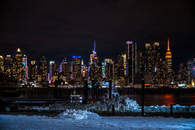 Illuminated city during winter at night