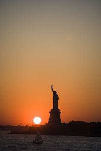 Statue of liberty, new york city at sunset.
