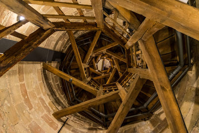 Low angle view of watermill interior