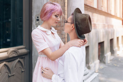 Lesbian couple romancing in city