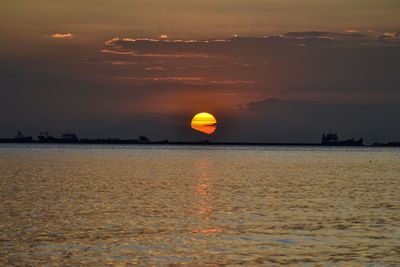 Scenic view of sea at sunset