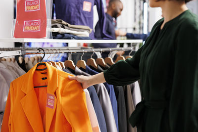 Close-up of clothes hanging in store