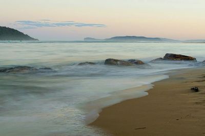 Scenic view of sea at sunset