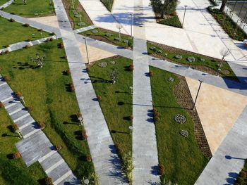 High angle view of footpath and field in city