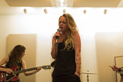 Young musicians practicing at a rehearsal space