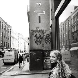 Woman standing on city street