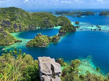 High angle view of sea against sky lagoon in raja ampat archipelago 