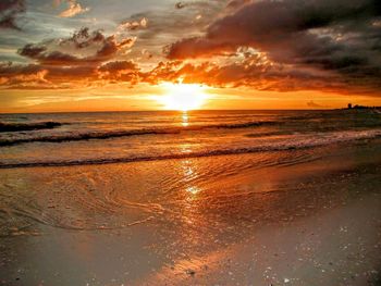 Scenic view of sea against cloudy sky