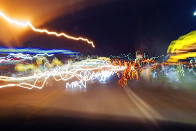 View of illuminated road at night