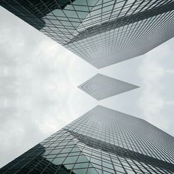 Low angle view of building against cloudy sky