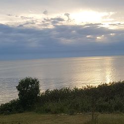 Scenic view of sea against sky at sunset