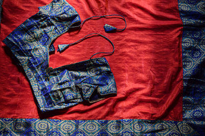 High angle view of multi colored umbrella on bed