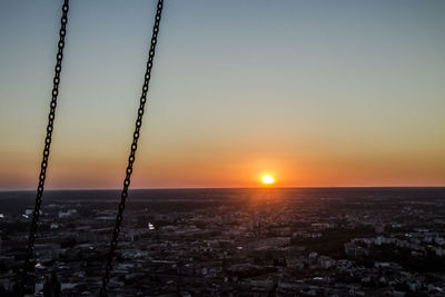 Scenic view of sunset over city