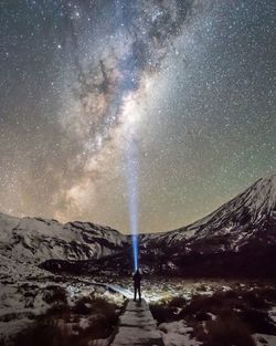 Scenic view of landscape against sky at night