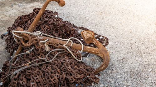 High angle view of rope tied up on wood