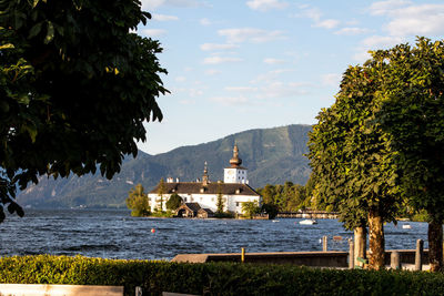 View of trees and buildings against sky