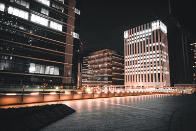 Buildings in city at night