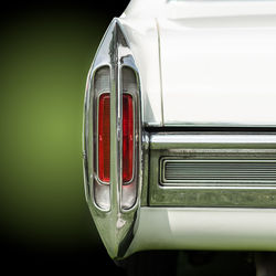 Close-up of vintage car against white background