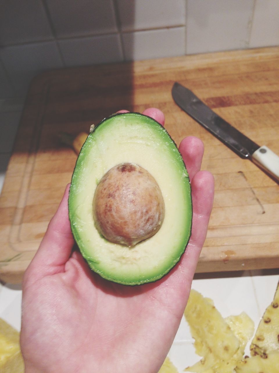 food and drink, food, freshness, healthy eating, person, holding, fruit, indoors, part of, cropped, table, unrecognizable person, lifestyles, personal perspective, ready-to-eat, slice, vegetable