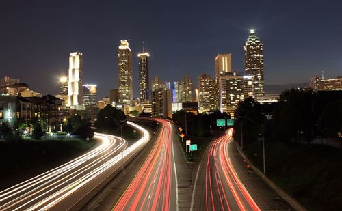 High angle view of light trails on multiple lane highway in city at night