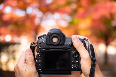 Close-up of hand holding camera