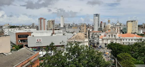 High angle view of buildings in city against sky