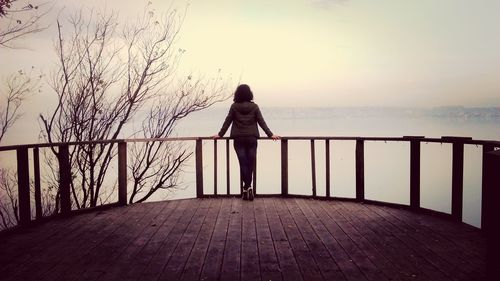 Man standing on pier