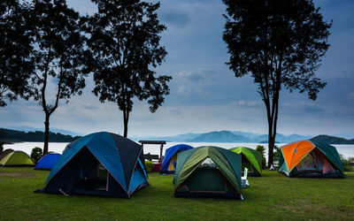 Scenic view of tent on landscape against sky