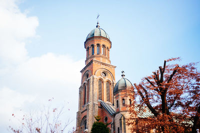 Low angle view of clock tower against sky