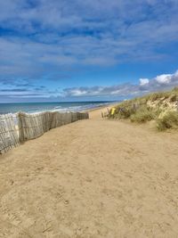 Scenic view of beach against sky