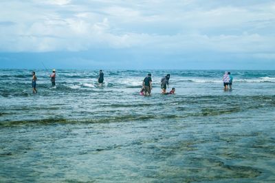 People enjoying at beach