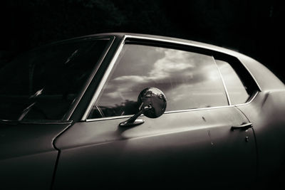 Side view of a man on side-view mirror