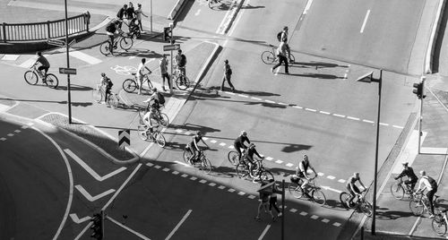 High angle view of people walking on zebra crossing