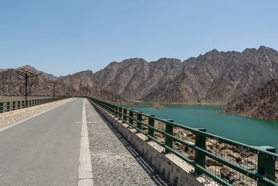 Scenic view of mountains against clear blue sky