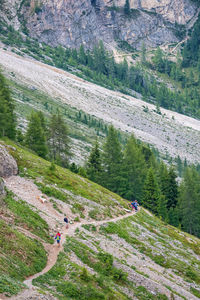 Hikers on a footpath in the alps