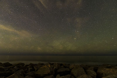 Scenic view of sea against sky at night