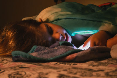 Girl sleeping on bed