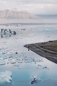 Scenic view of icebergs on lake