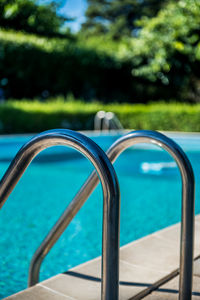 Close-up of swimming pool against blue sky