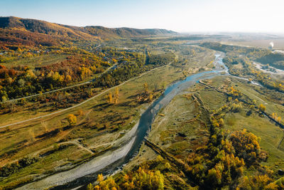 Aerial view of river in drought conditions by mountains