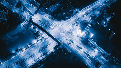 High angle view of illuminated city buildings at night