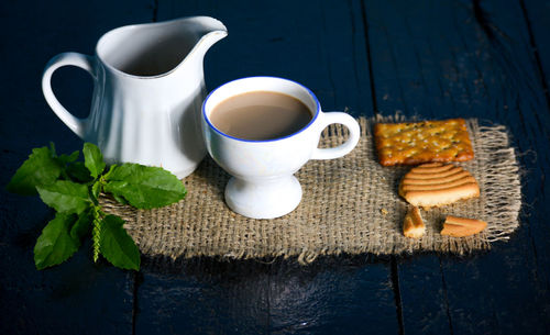 Cup of coffee with tea served on table