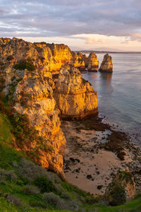 Praia do amado beach at sunset in costa vicentina, portugal