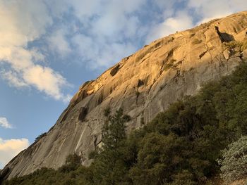 Low angle view of rock formations against sky