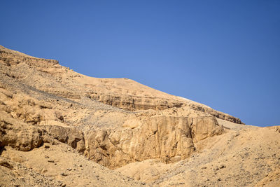 Desert landscape in egypt. view of sandy hill against clear blue sky. copy space for text.