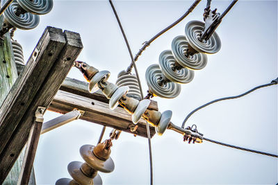 Low angle view of utility pole against sky