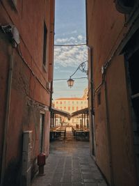 Narrow alley amidst buildings in city